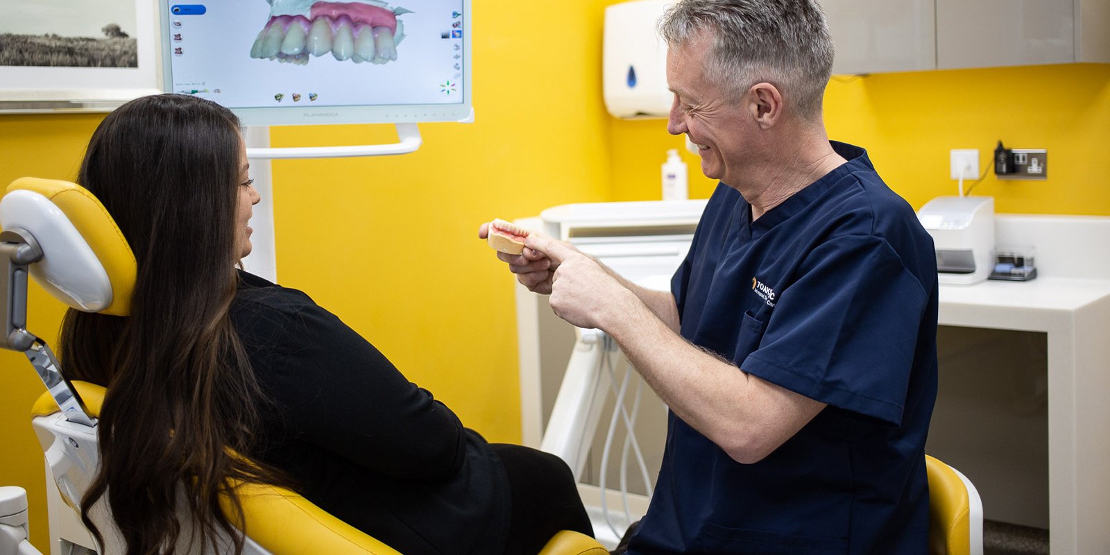 Dentist showing teeth demonstration