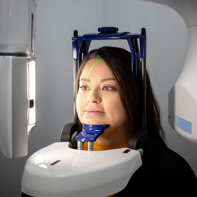 Lady receiving a dental scan